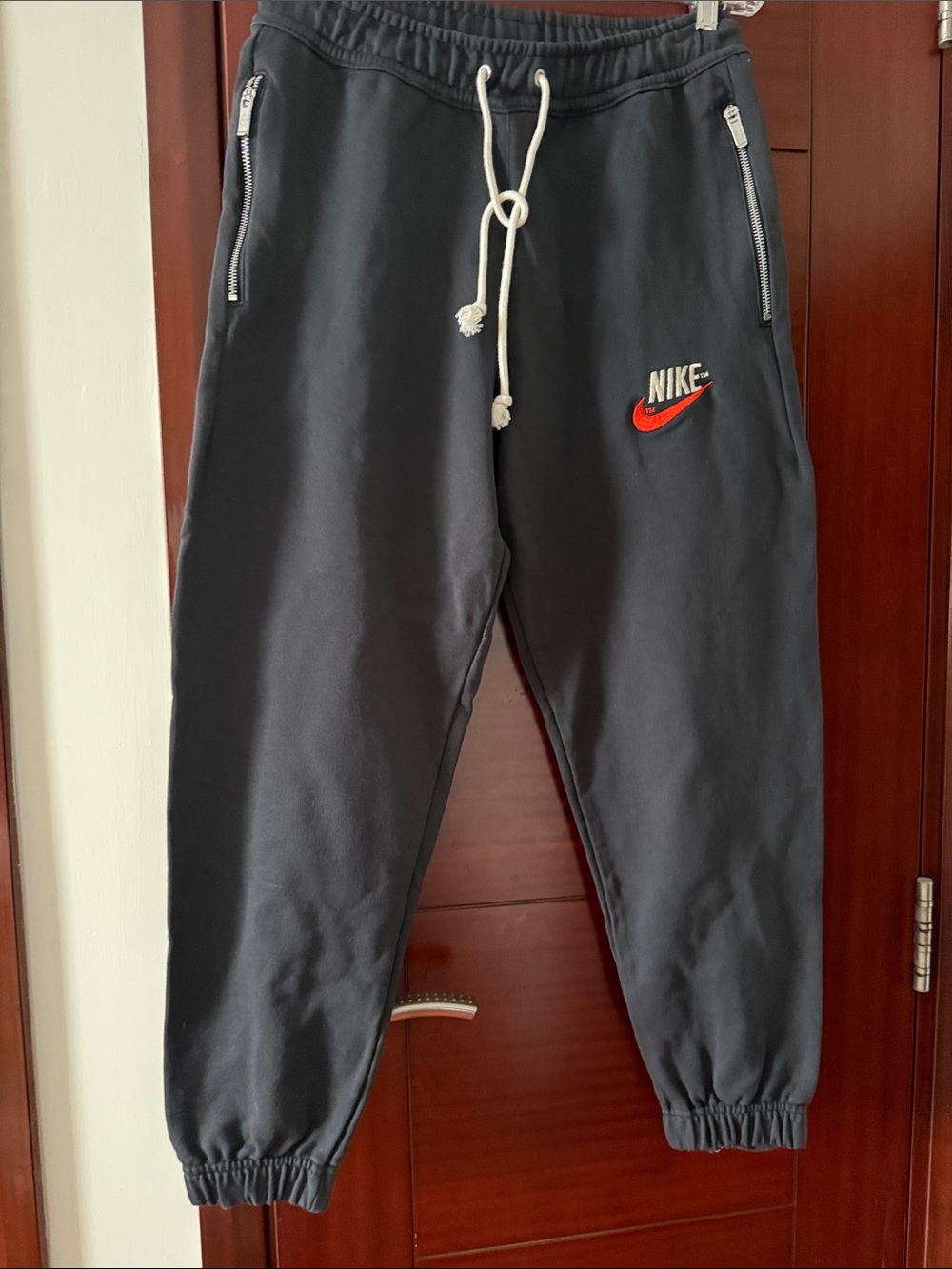 Nike Black Jogger Sweatpants with Red Swoosh and White Drawstring